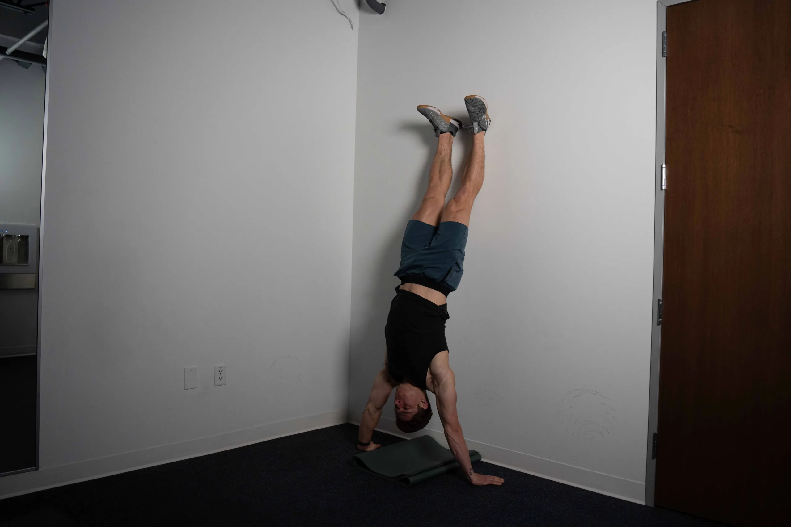 The Wall Handstand Push-up - Tutorials and Progressions - Roam Strong